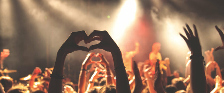 Heartshaped hands at concert